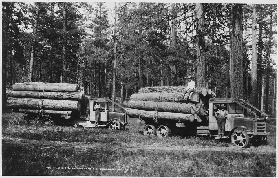 Ladd_photo_of_solid-tired_Moreland_logging_trucks_of_Biles_Coleman_Lumber_Co._on_the_Moses_Mountain_logging_unit...._-_NARA_-_298699